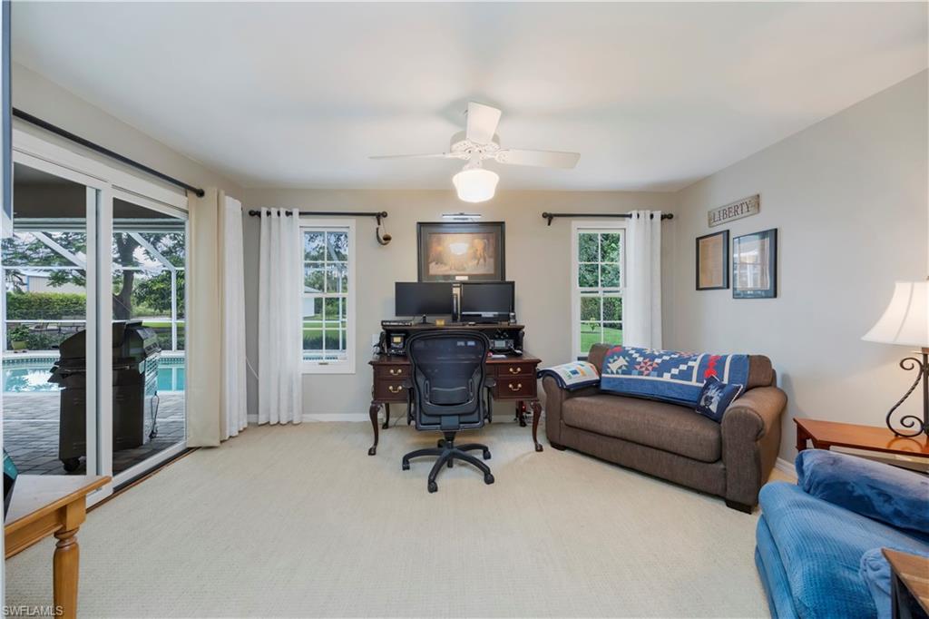 5520 Cynthia Lane Naples, FL 34112 - Photo 15 of 32 a living room with furniture and a window