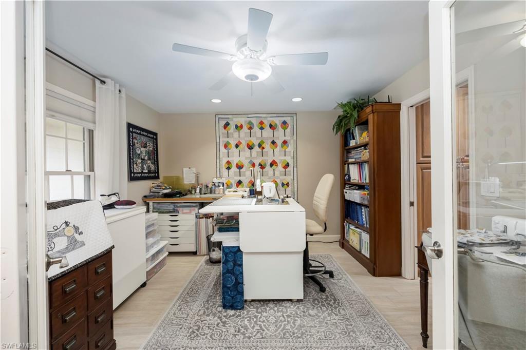 5520 Cynthia Lane Naples, FL 34112 - Photo 16 of 32 a kitchen with a refrigerator and a stove