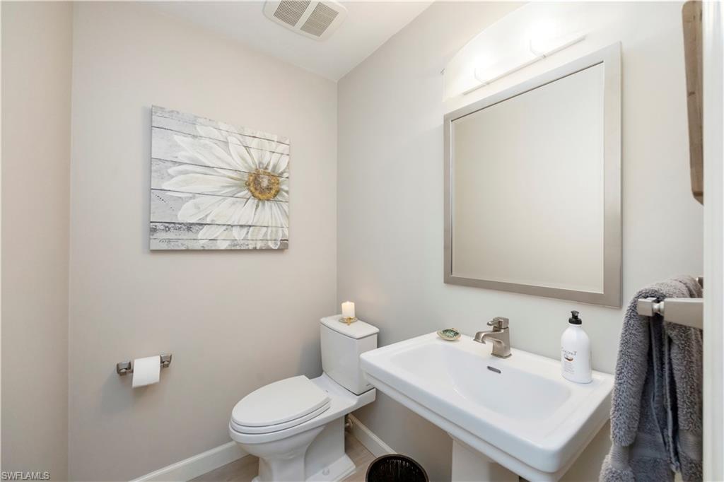 5520 Cynthia Lane Naples, FL 34112 - Photo 17 of 32 a bathroom with a sink mirror and toilet