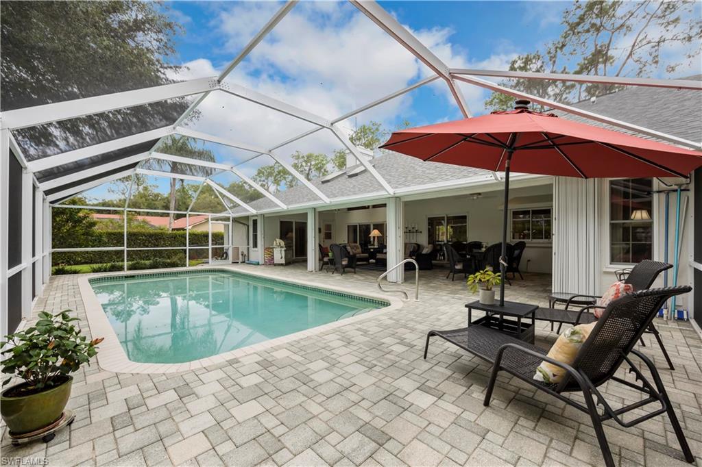 5520 Cynthia Lane Naples, FL 34112 - Photo 21 of 32 a view of a house with a swimming pool