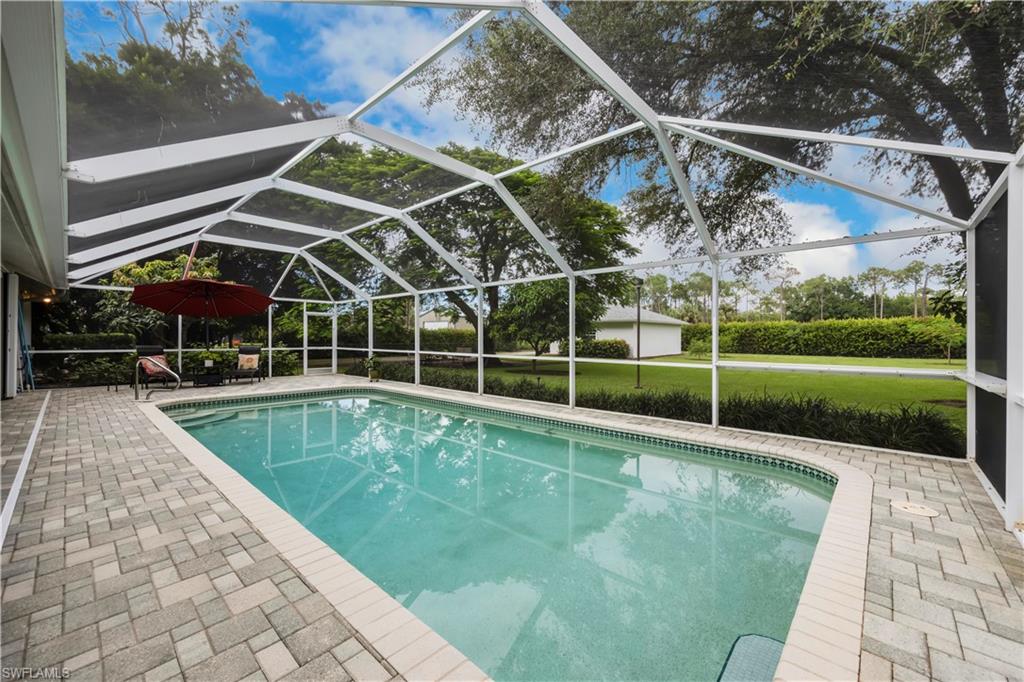 5520 Cynthia Lane Naples, FL 34112 - Photo 22 of 32 a view of a backyard with swimming pool