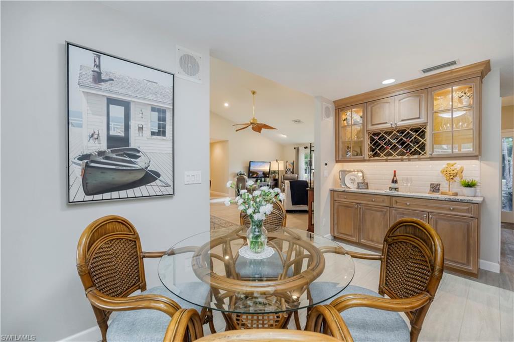 5520 Cynthia Lane Naples, FL 34112 - Photo 6 of 32 a living room with furniture and a fireplace