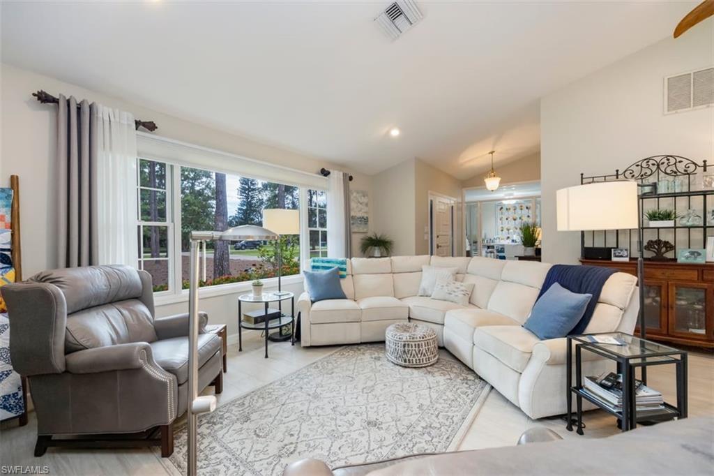 5520 Cynthia Lane Naples, FL 34112 - Photo 8 of 32 a living room with furniture and a large window