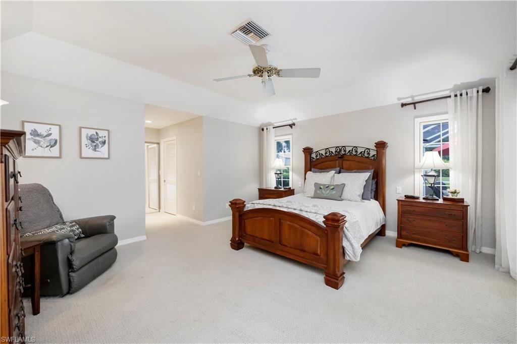 5520 Cynthia Lane Naples, FL 34112 - Photo 10 of 32 a bedroom with bed couch and window