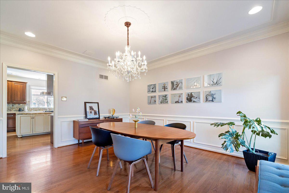 1488 Heather Ridge Drive Newtown, PA 18940 - Photo 11 of 46 a view of a dining room with furniture wooden floor and chandelier