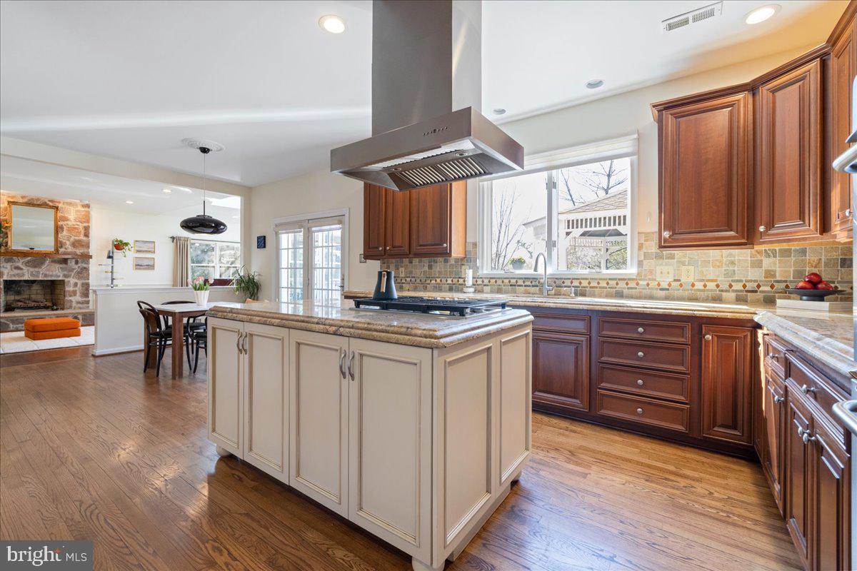 1488 Heather Ridge Drive Newtown, PA 18940 - Photo 14 of 46 a kitchen with granite countertop wooden cabinets a sink a window and appliances