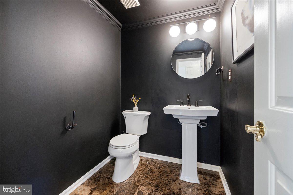 1488 Heather Ridge Drive Newtown, PA 18940 - Photo 24 of 46 a bathroom with a sink toilet and a mirror