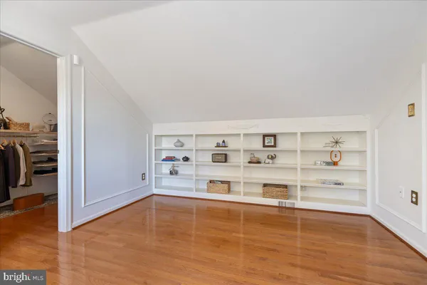an empty room with shelves