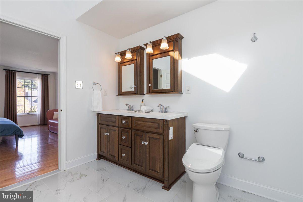 1488 Heather Ridge Drive Newtown, PA 18940 - Photo 33 of 46 a bathroom with a toilet sink vanity granite and mirror