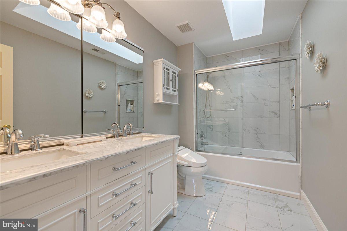 1488 Heather Ridge Drive Newtown, PA 18940 - Photo 38 of 46 a bathroom with a granite countertop sink toilet mirror and bathtub