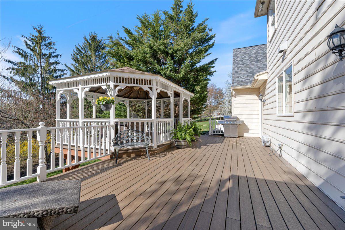 1488 Heather Ridge Drive Newtown, PA 18940 - Photo 42 of 46 a view of a wooden deck with furniture