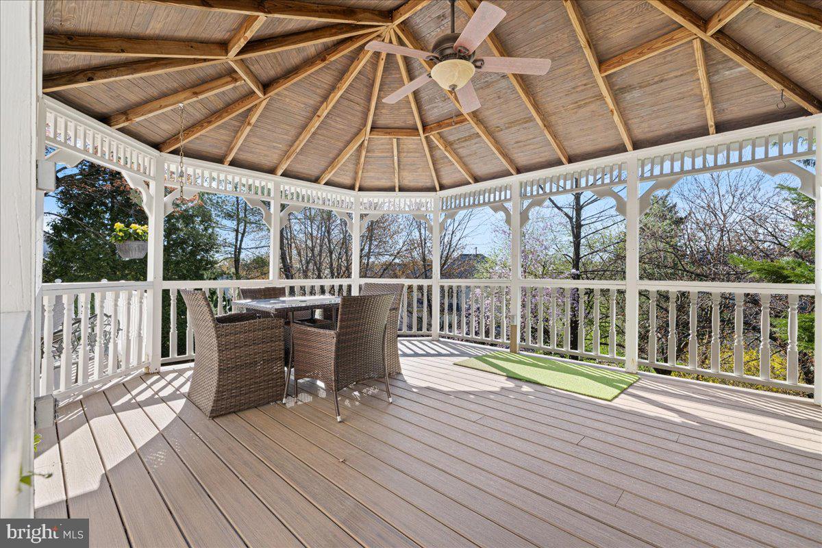 1488 Heather Ridge Drive Newtown, PA 18940 - Photo 44 of 46 a view of deck with wooden floor and fence with a floor to ceiling window