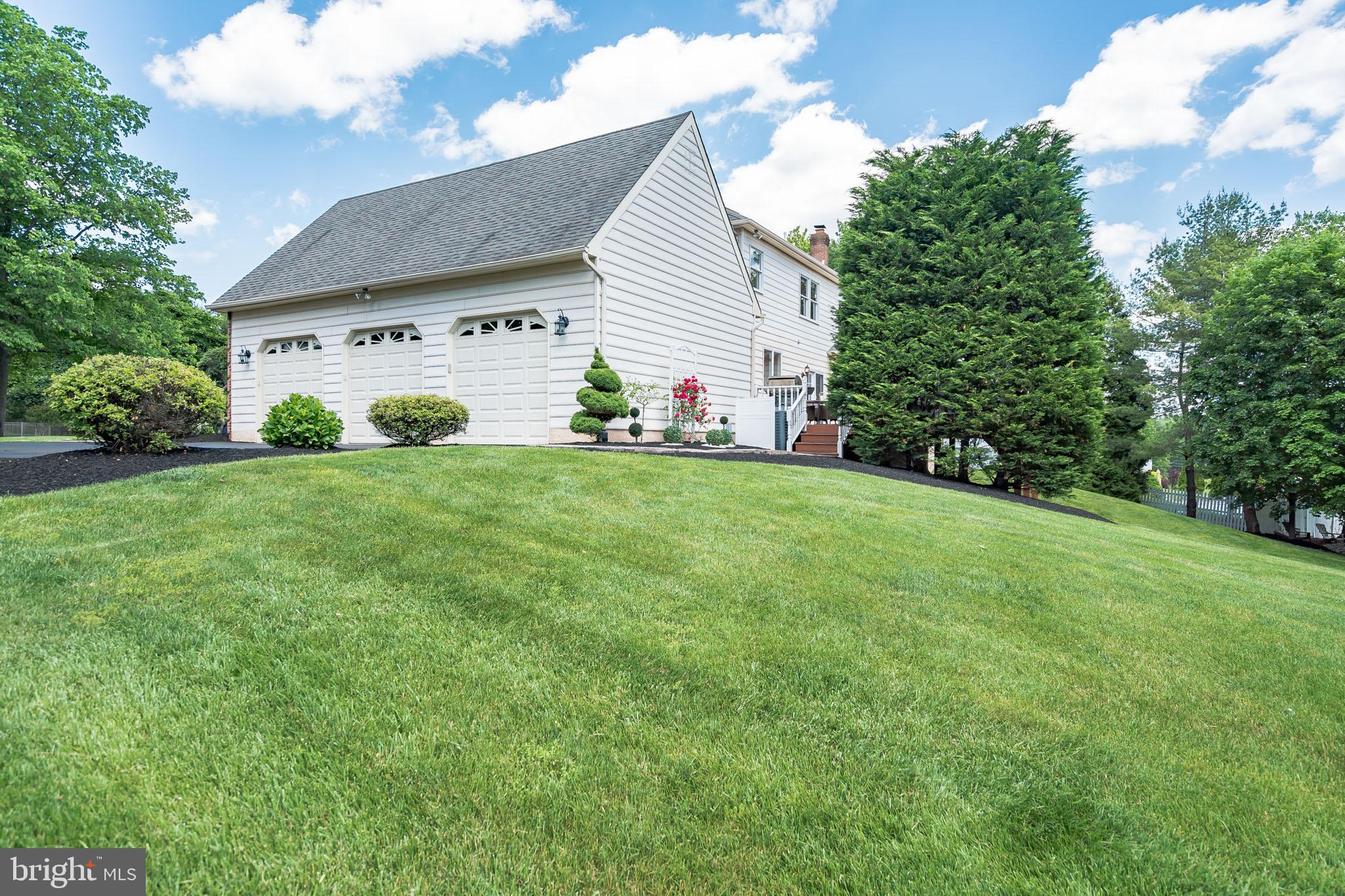 1488 Heather Ridge Drive Newtown, PA 18940 - Photo 46 of 46 a view of a house with a yard and sitting area