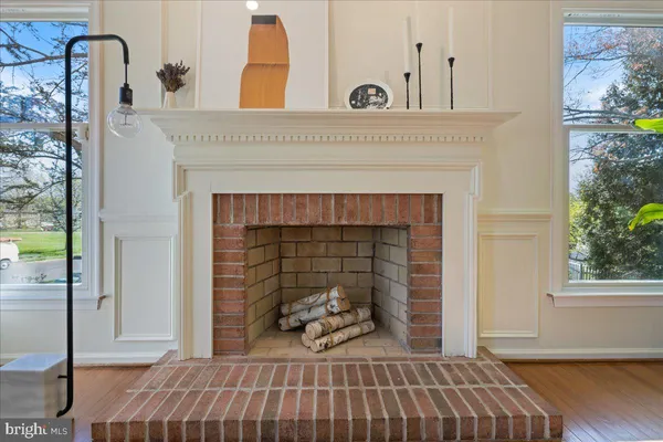 a view of a livingroom with furniture and a fireplace