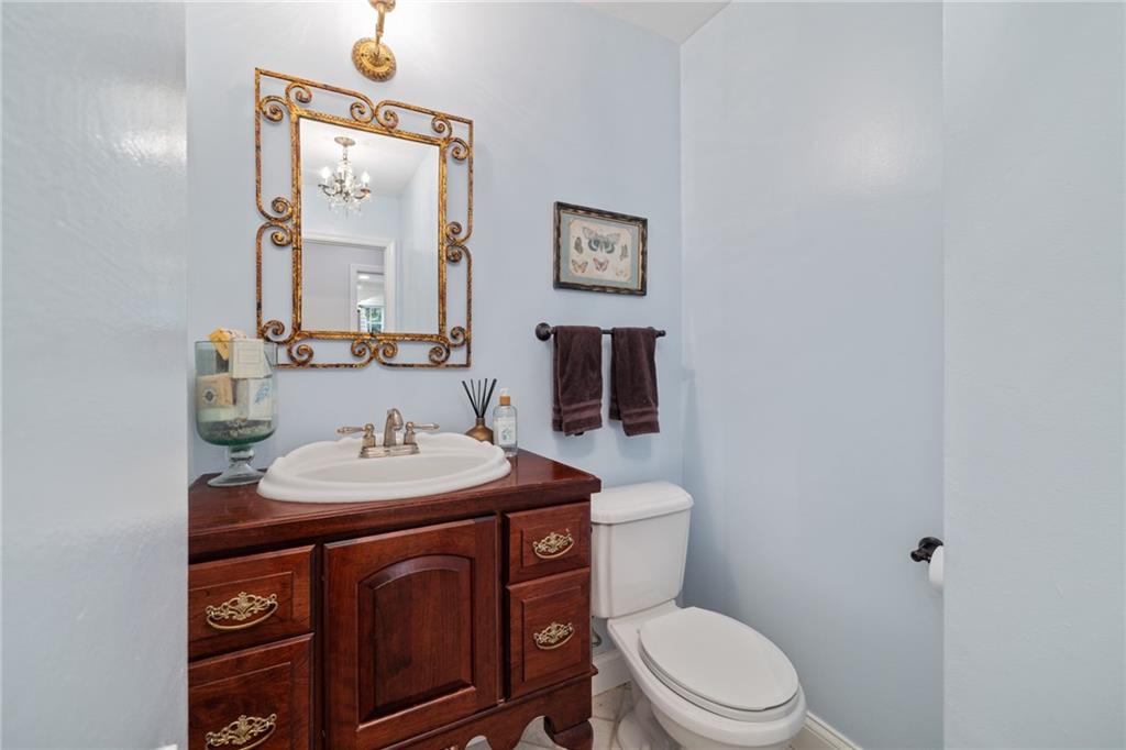 800 Hulton Road Oakmont, PA 15139 - Photo 11 of 25 a bathroom with a toilet sink and mirror