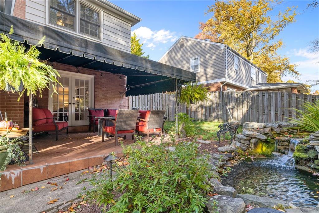 800 Hulton Road Oakmont, PA 15139 - Photo 23 of 25 a view of a chairs and table in the back yard of the house