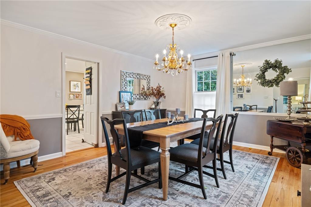 800 Hulton Road Oakmont, PA 15139 - Photo 7 of 25 a view of a dining room with furniture a chandelier and wooden floor