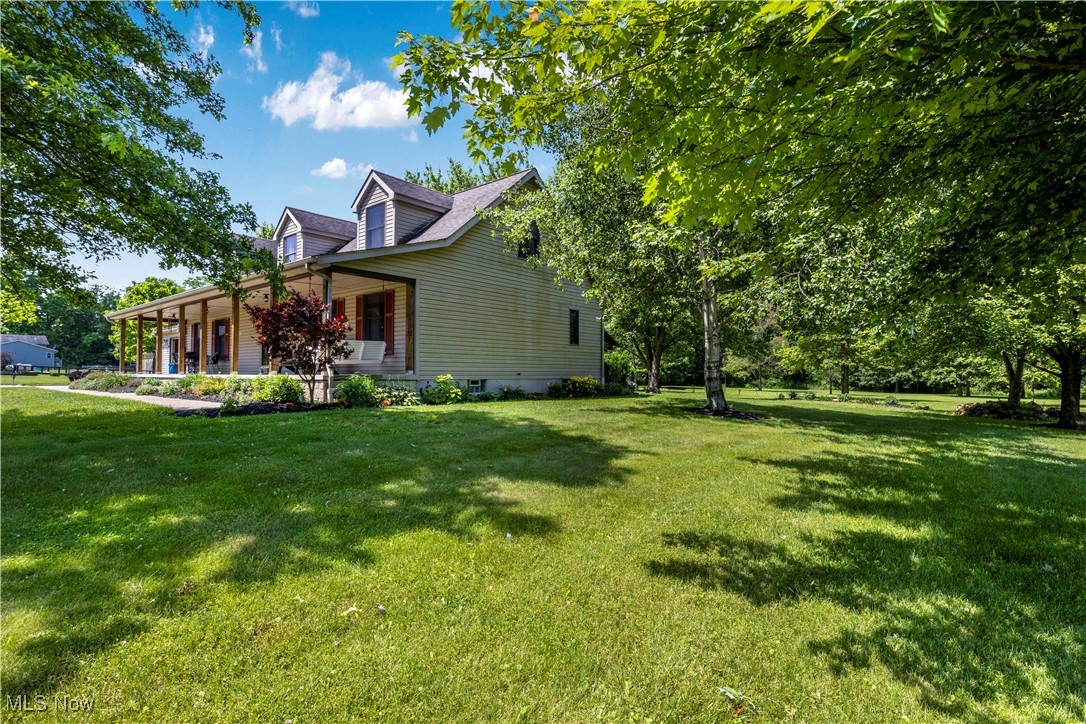1264 Ellsworth Bailey Road Warren, OH 44481 - Photo 7 of 45 View of home's exterior with a porch and a yard