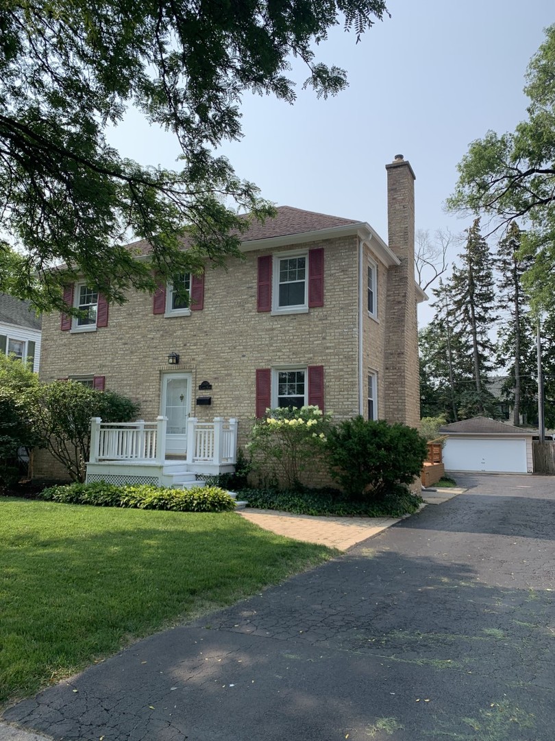 2125 Illinois Road Northbrook, IL 60062 - Photo 1 of 5 a front view of a house with a garden