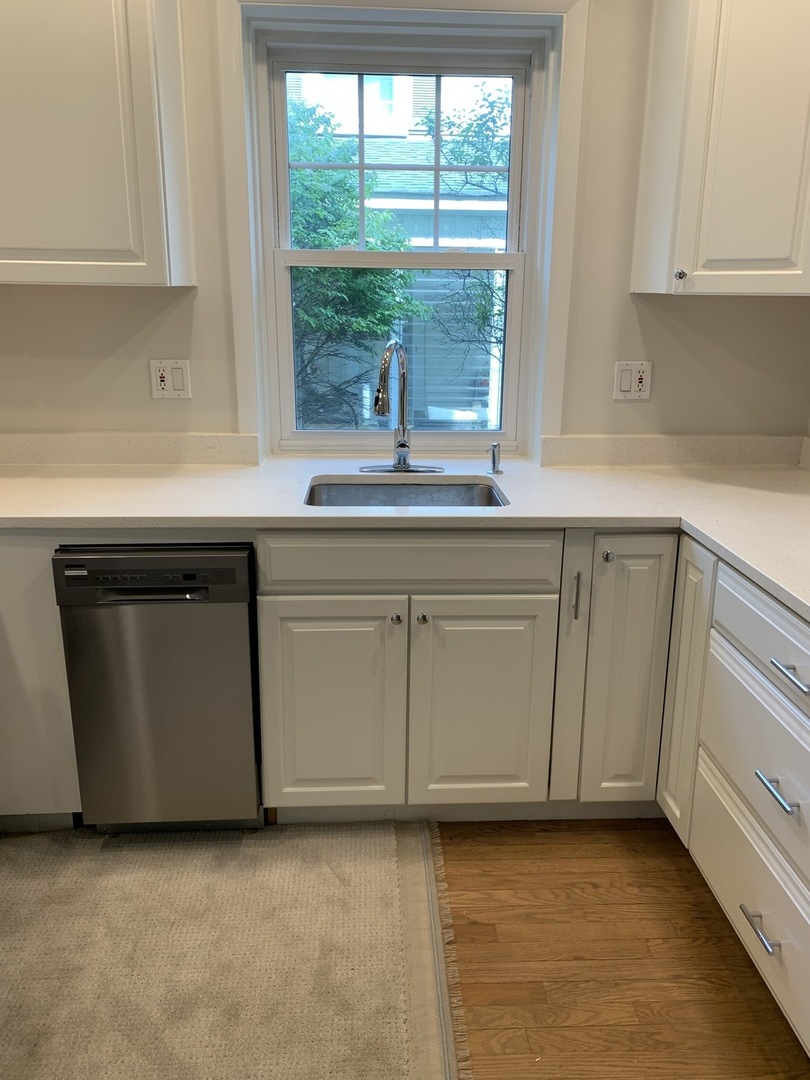 2125 Illinois Road Northbrook, IL 60062 - Photo 2 of 5 a kitchen with granite countertop a sink and a cabinets