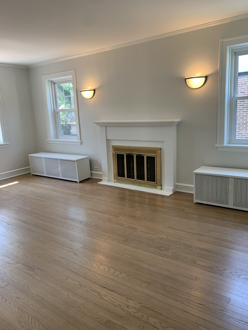 2125 Illinois Road Northbrook, IL 60062 - Photo 3 of 5 a living room with furniture and a wooden floor