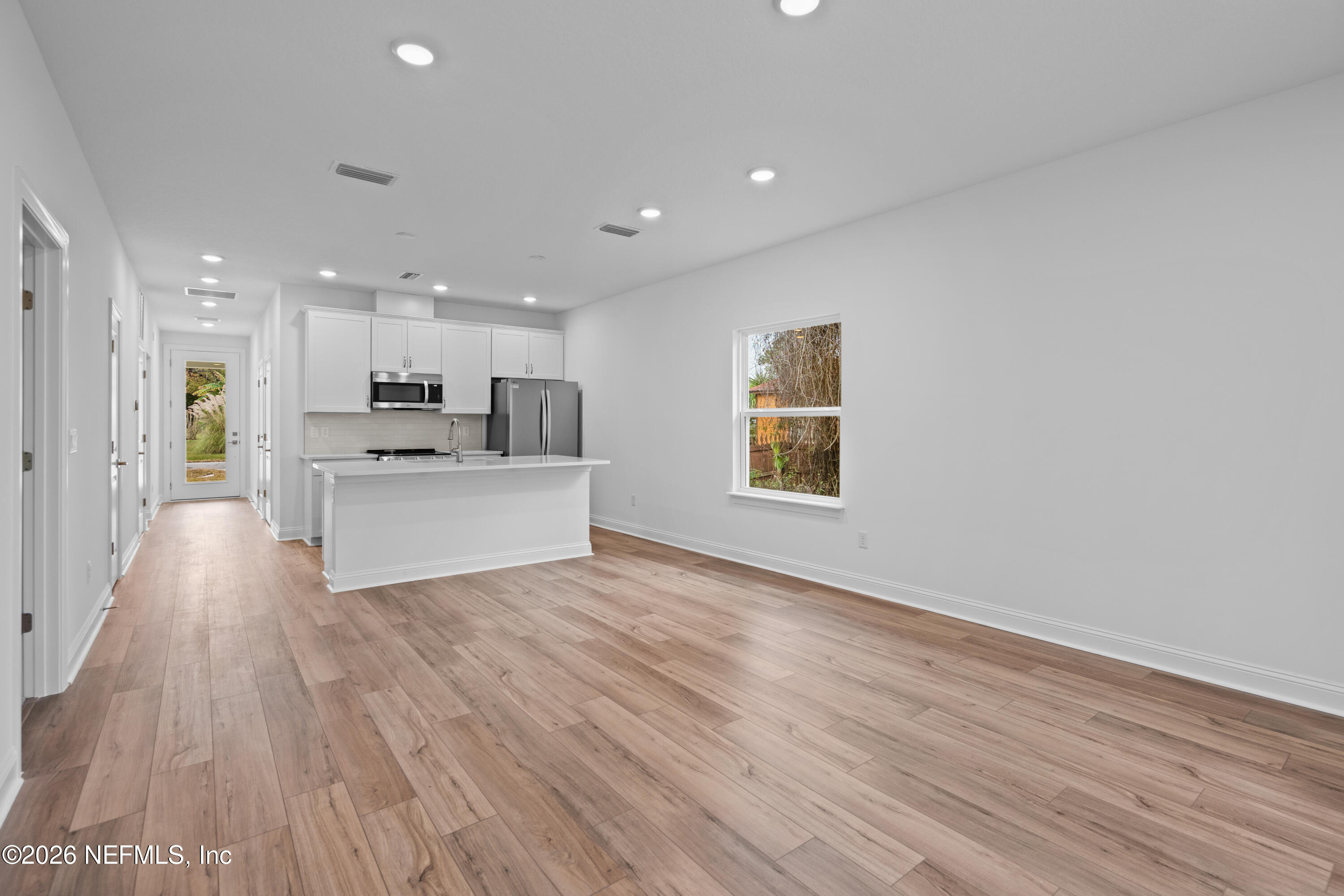 221 Dartmouth Road St. Augustine, FL 32086 - Photo 17 of 24 a view of kitchen with wooden floor and electronic appliances