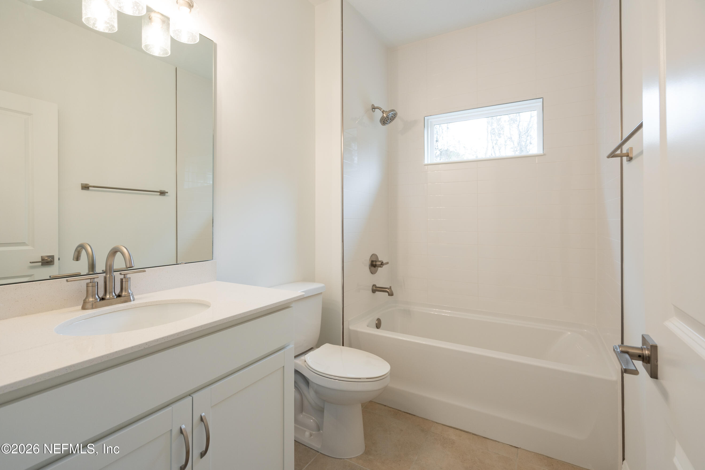 221 Dartmouth Road St. Augustine, FL 32086 - Photo 9 of 24 a bathroom with a sink a toilet and shower