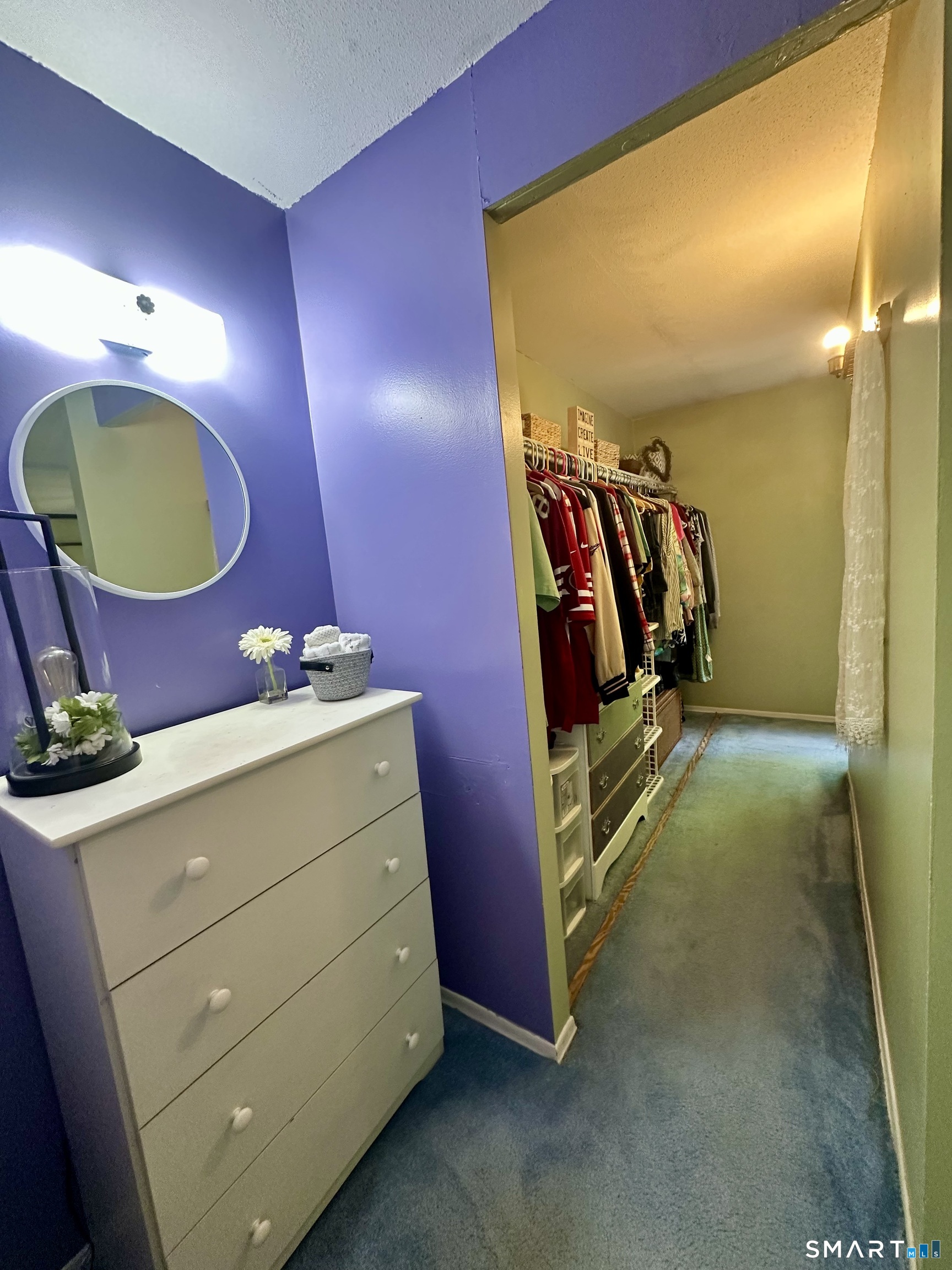 2 Lakeside Drive, Unit M Ledyard, CT 06339 - Photo 21 of 38 a bedroom with a bed and a mirror