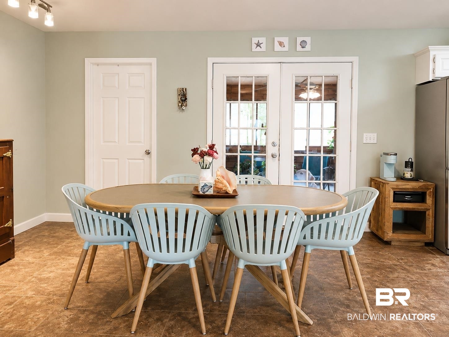 21733 Sedlack Road Silverhill, AL 36576 - Photo 11 of 22 Open-concept dining area featuring light-toned walls, durable flooring, and French patio doors providing exterior access