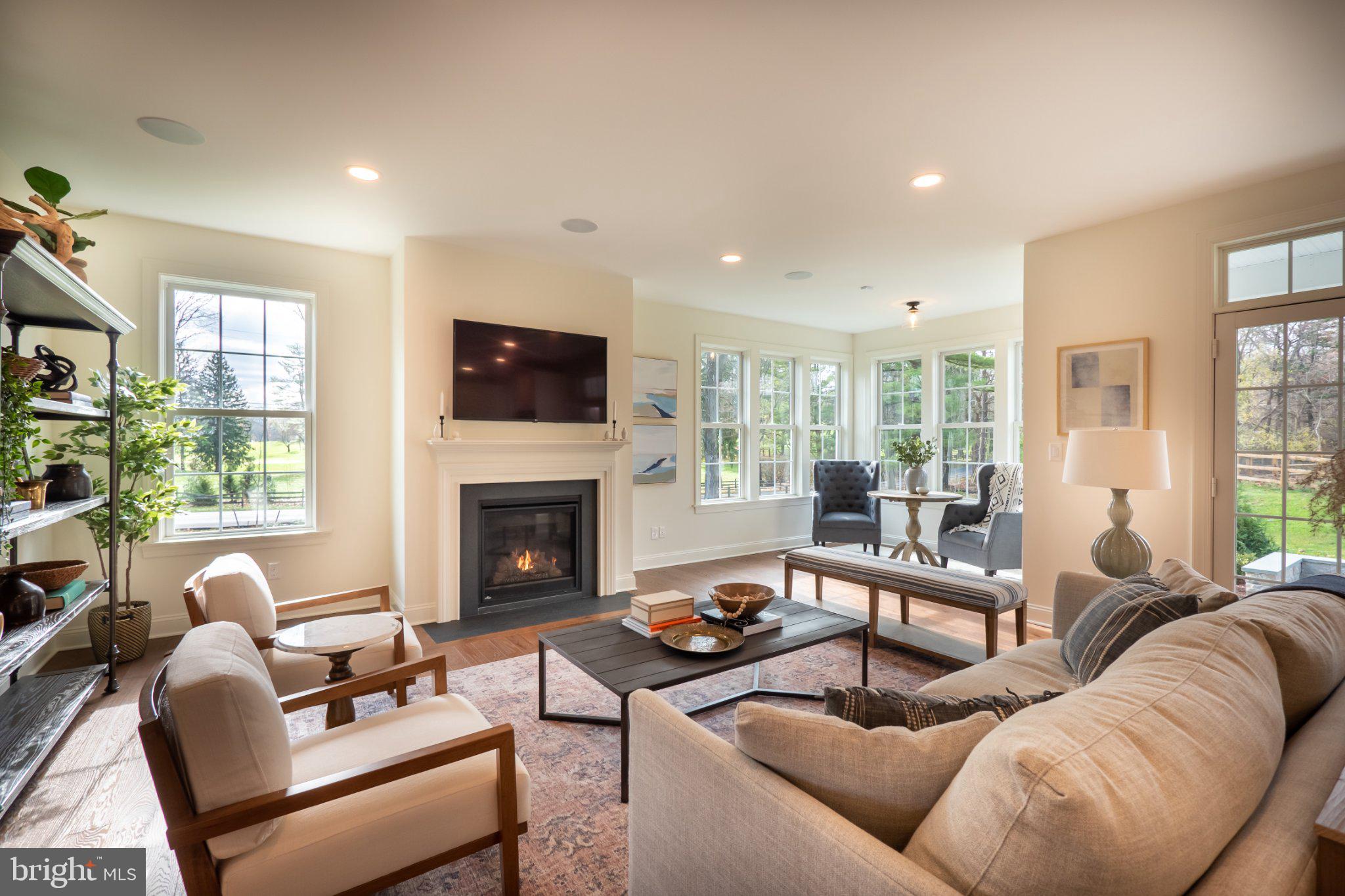 4630 Old Saucon Road Bethlehem, PA 18015 - Photo 11 of 33 a living room with furniture flat screen tv and a fireplace