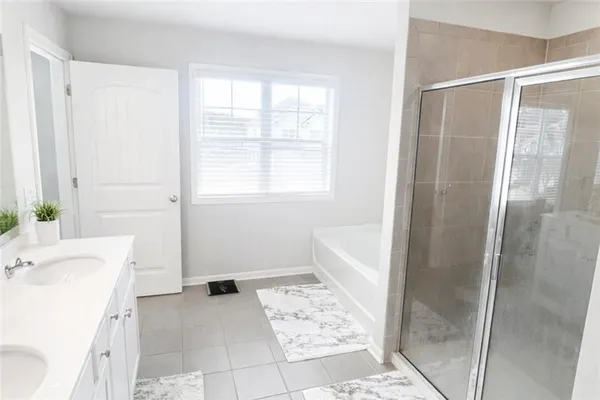 a bathroom with a bathtub and a sink