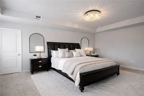 a bedroom with a bed and a mirror