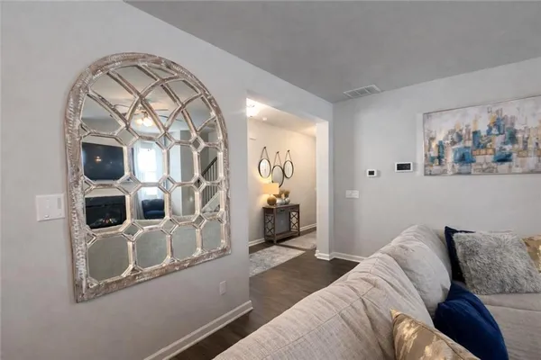 a bedroom with a bed and a mirror