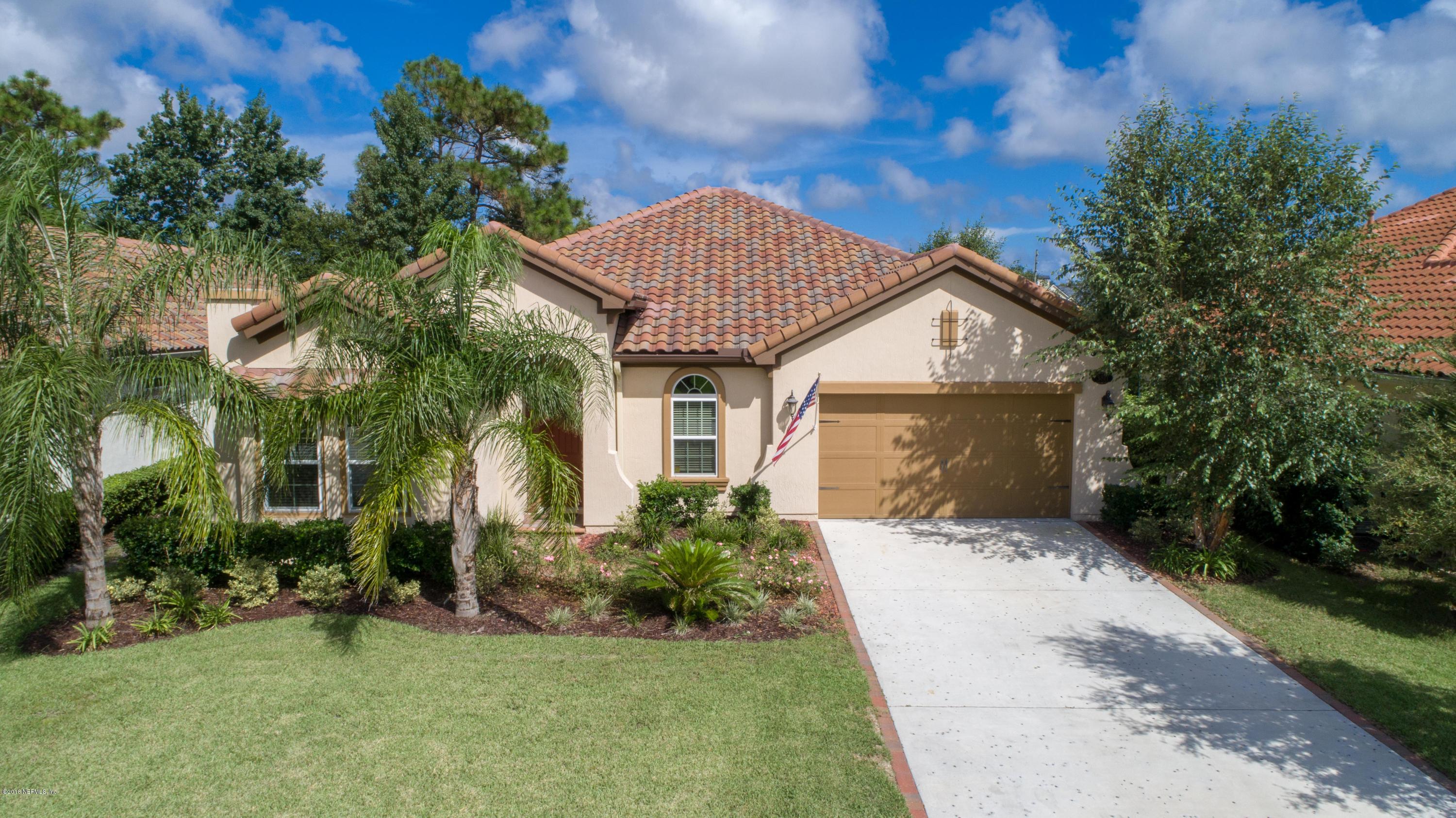 3811 Valverde Circle Jacksonville, FL 32224 - Photo 1 of 42 a front view of a house with a garden and yard