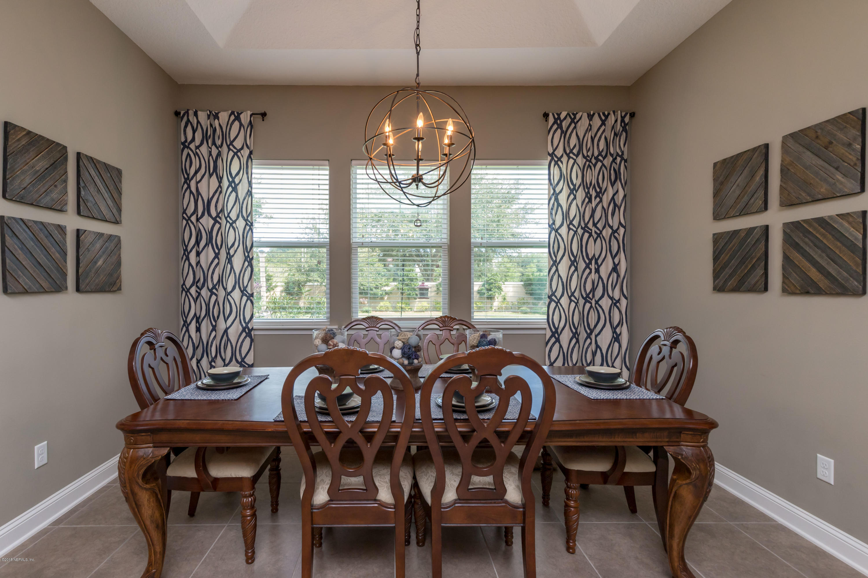 3811 Valverde Circle Jacksonville, FL 32224 - Photo 11 of 42 a view of a dining room with furniture window and outside view