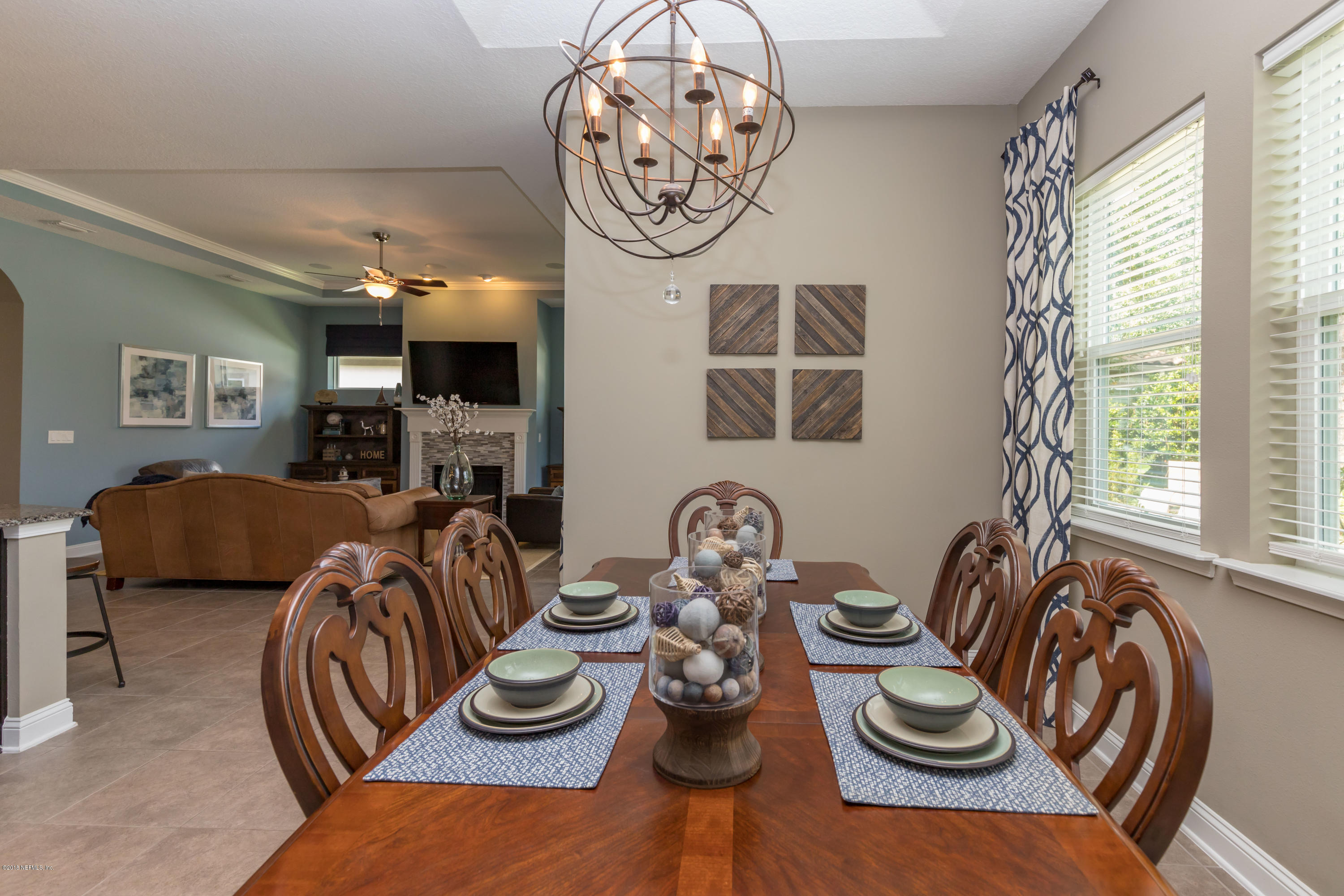3811 Valverde Circle Jacksonville, FL 32224 - Photo 12 of 42 a view of a dining room with furniture window and wooden floor