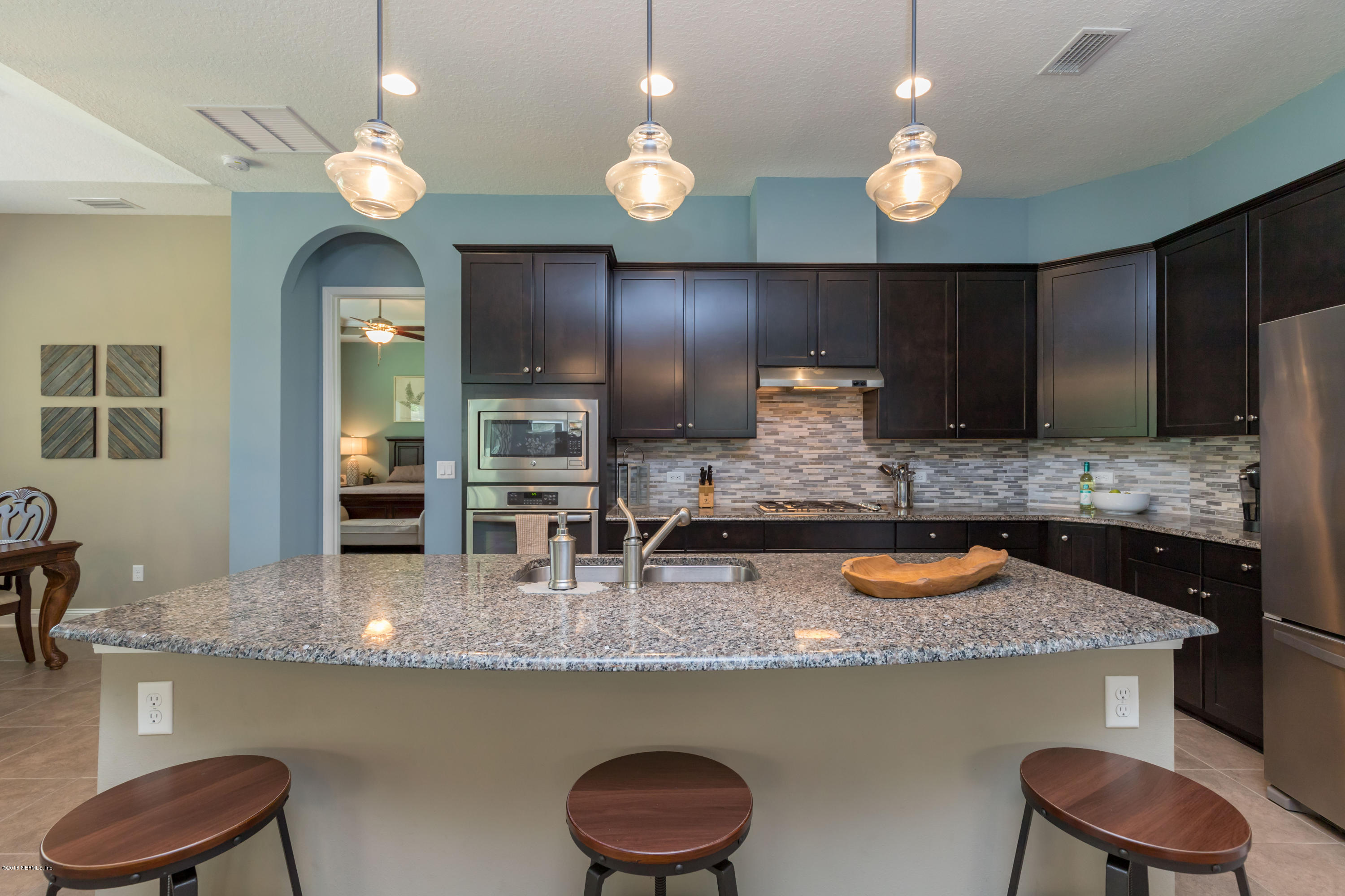 3811 Valverde Circle Jacksonville, FL 32224 - Photo 15 of 42 a kitchen with a counter space cabinets and appliances