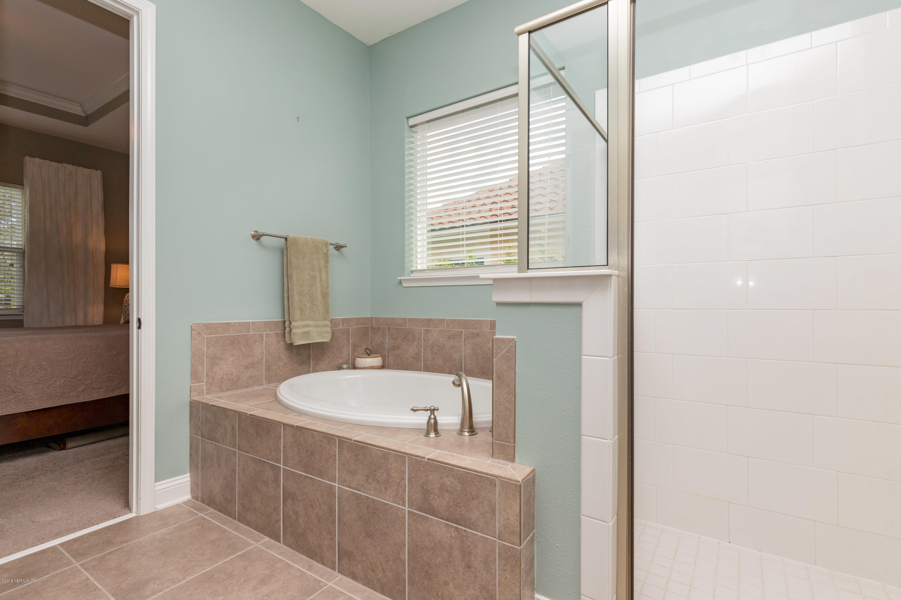 3811 Valverde Circle Jacksonville, FL 32224 - Photo 22 of 42 a bathroom with a bathtub and a sink
