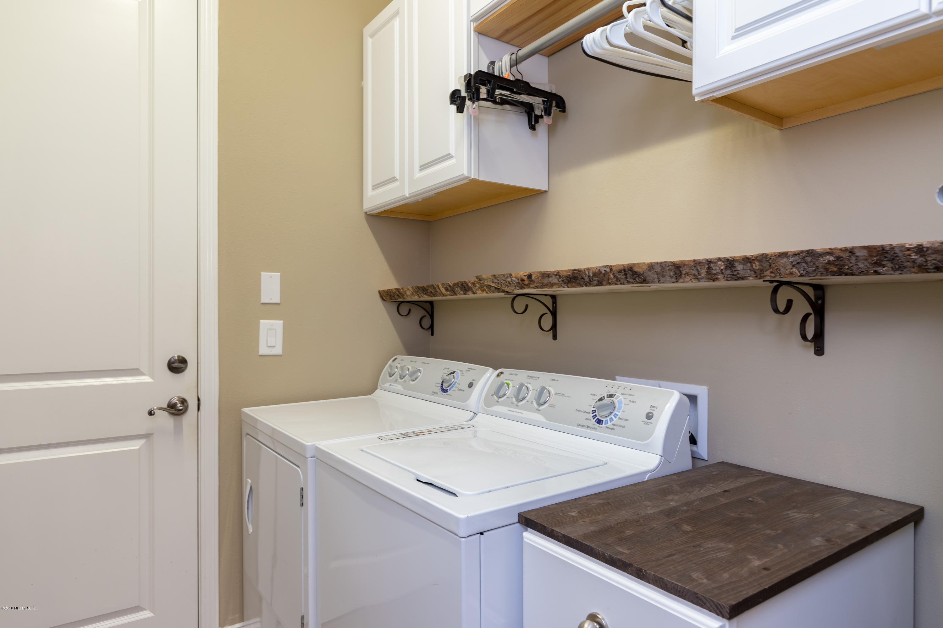 3811 Valverde Circle Jacksonville, FL 32224 - Photo 28 of 42 a utility room with dryer and washer