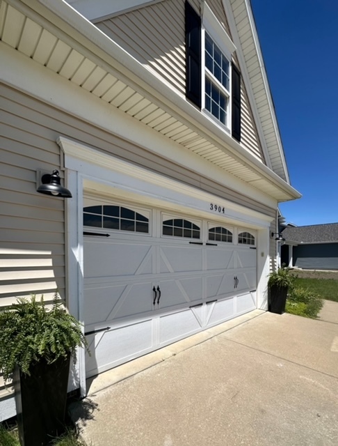 3904 Boulder Ridge Drive Champaign, IL 61822 - Photo 4 of 110 a front view of a house with a garage