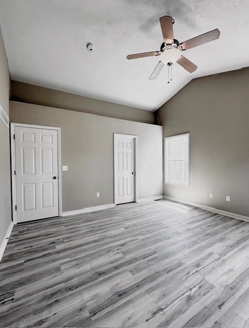 3904 Boulder Ridge Drive Champaign, IL 61822 - Photo 54 of 110 a view of an empty room with a window and wooden floor