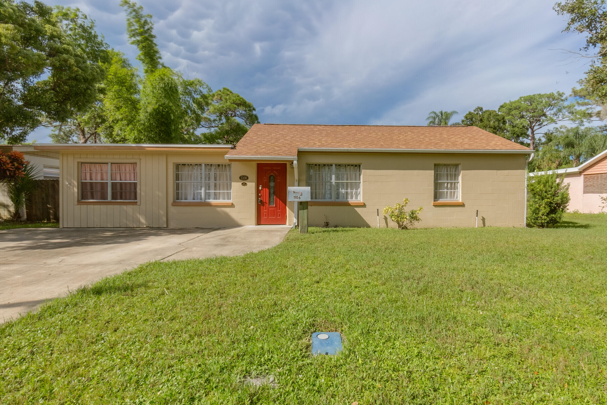 front view of a house with a yard