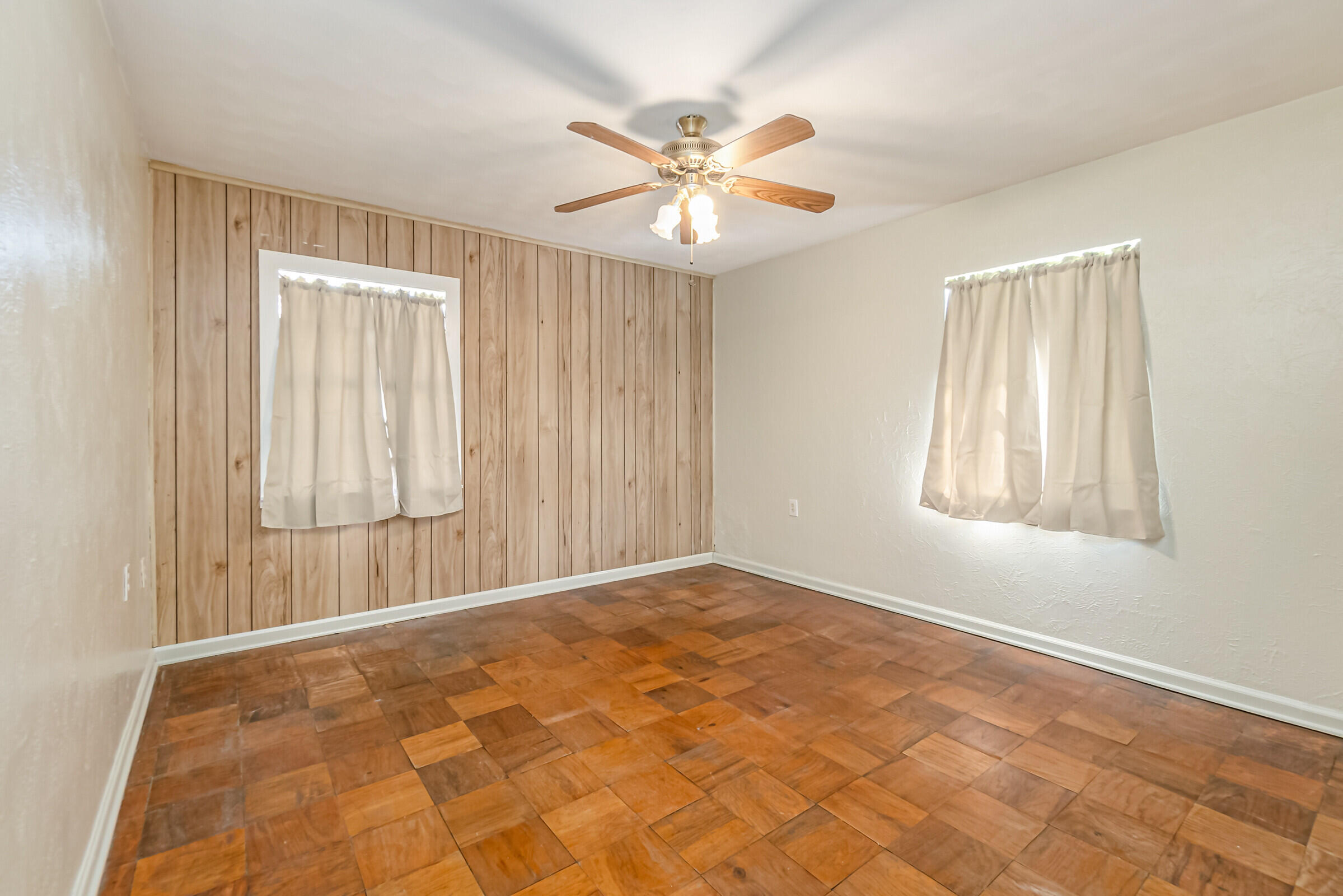 1106 Woodlawn Road Rockledge, FL 32955 - Photo 20 of 57 a view of an empty room with window and chandelier fan