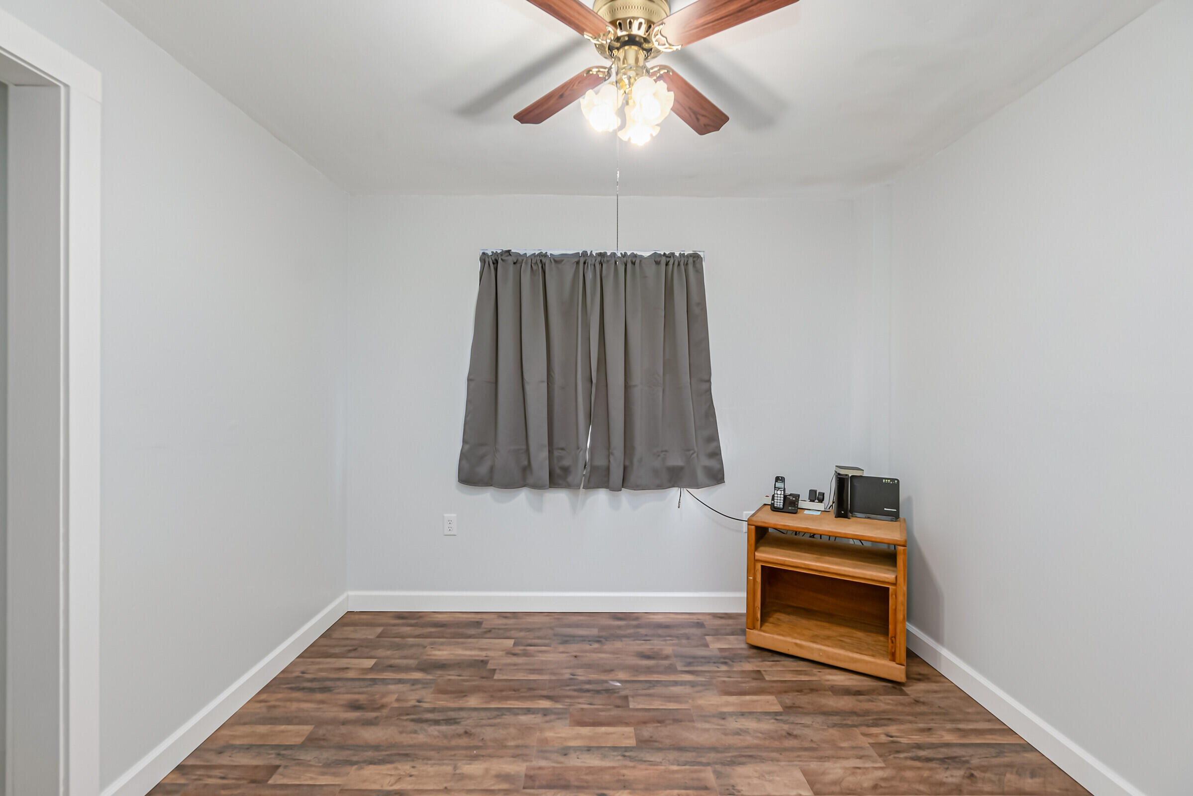 1106 Woodlawn Road Rockledge, FL 32955 - Photo 45 of 57 a room with a bed and a chandelier