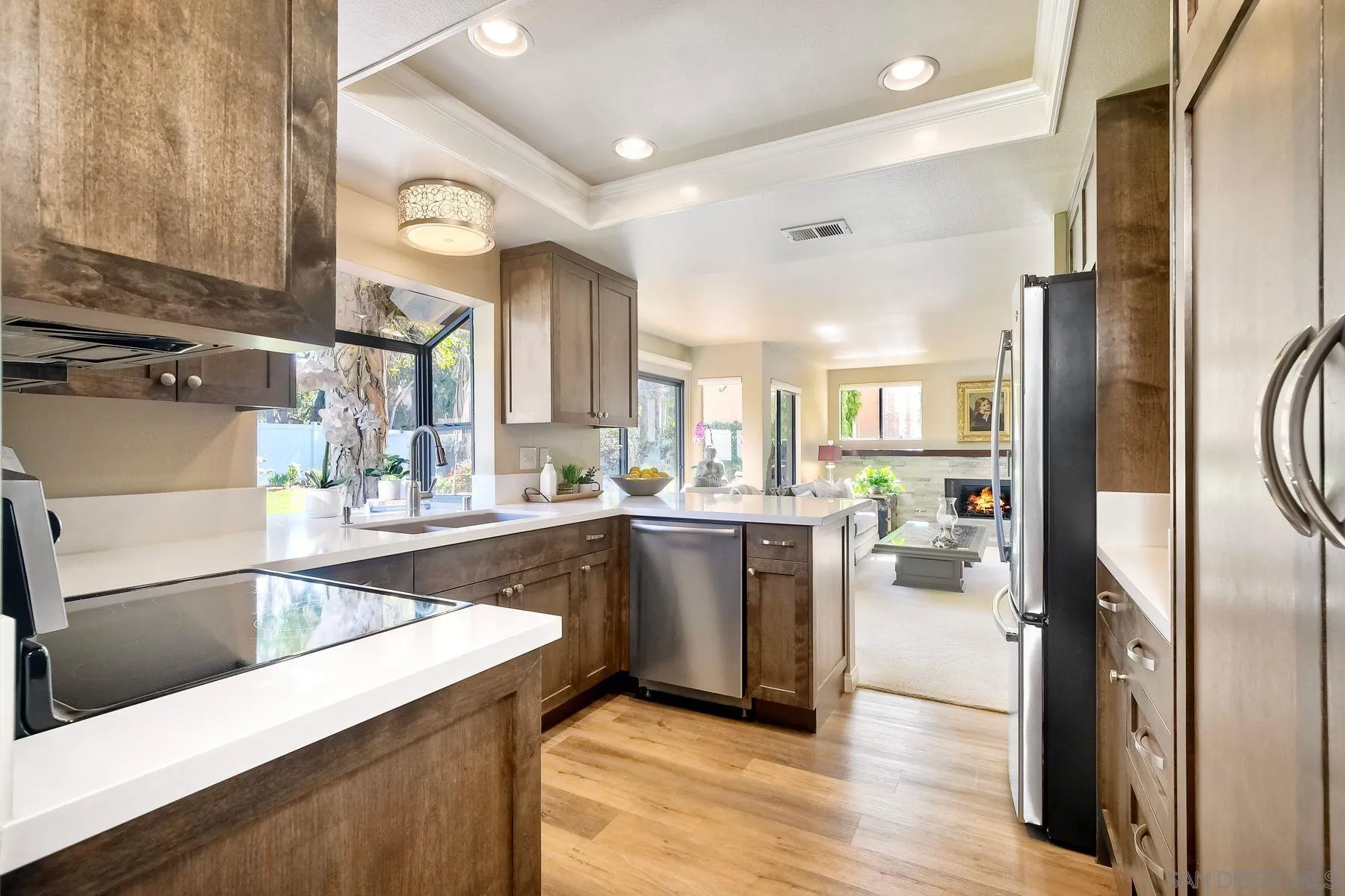 11467 Box Elder Place San Diego, CA 92127 - Photo 11 of 31 a large kitchen with a large window and stainless steel appliances