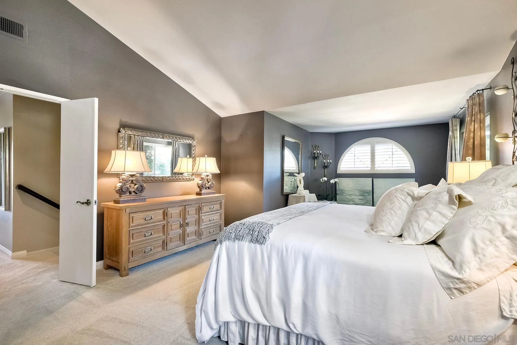 11467 Box Elder Place San Diego, CA 92127 - Photo 18 of 31 a bedroom with a bed and a mirror