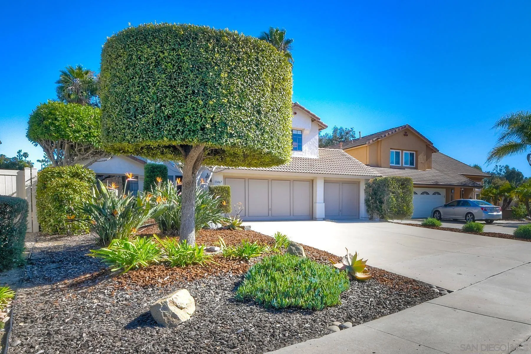 11467 Box Elder Place San Diego, CA 92127 - Photo 2 of 31 a front view of a house with garden