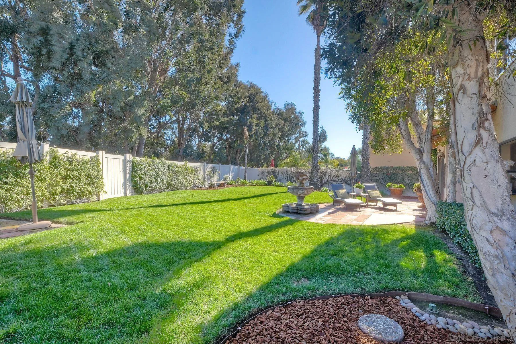 11467 Box Elder Place San Diego, CA 92127 - Photo 27 of 31 a view of yard with swimming pool and green space