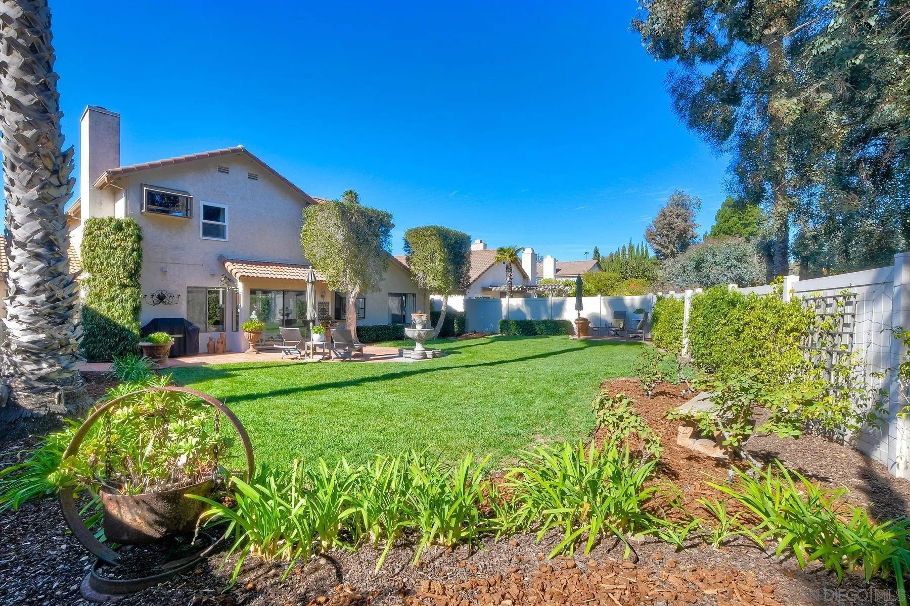11467 Box Elder Place San Diego, CA 92127 - Photo 30 of 31 a front view of a house with garden