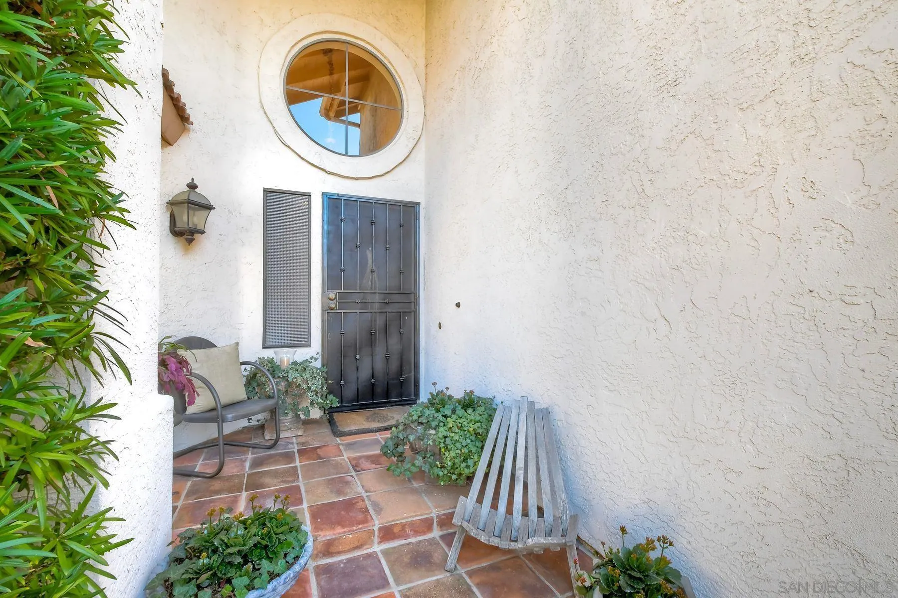 11467 Box Elder Place San Diego, CA 92127 - Photo 3 of 31 a front view of a house with garden